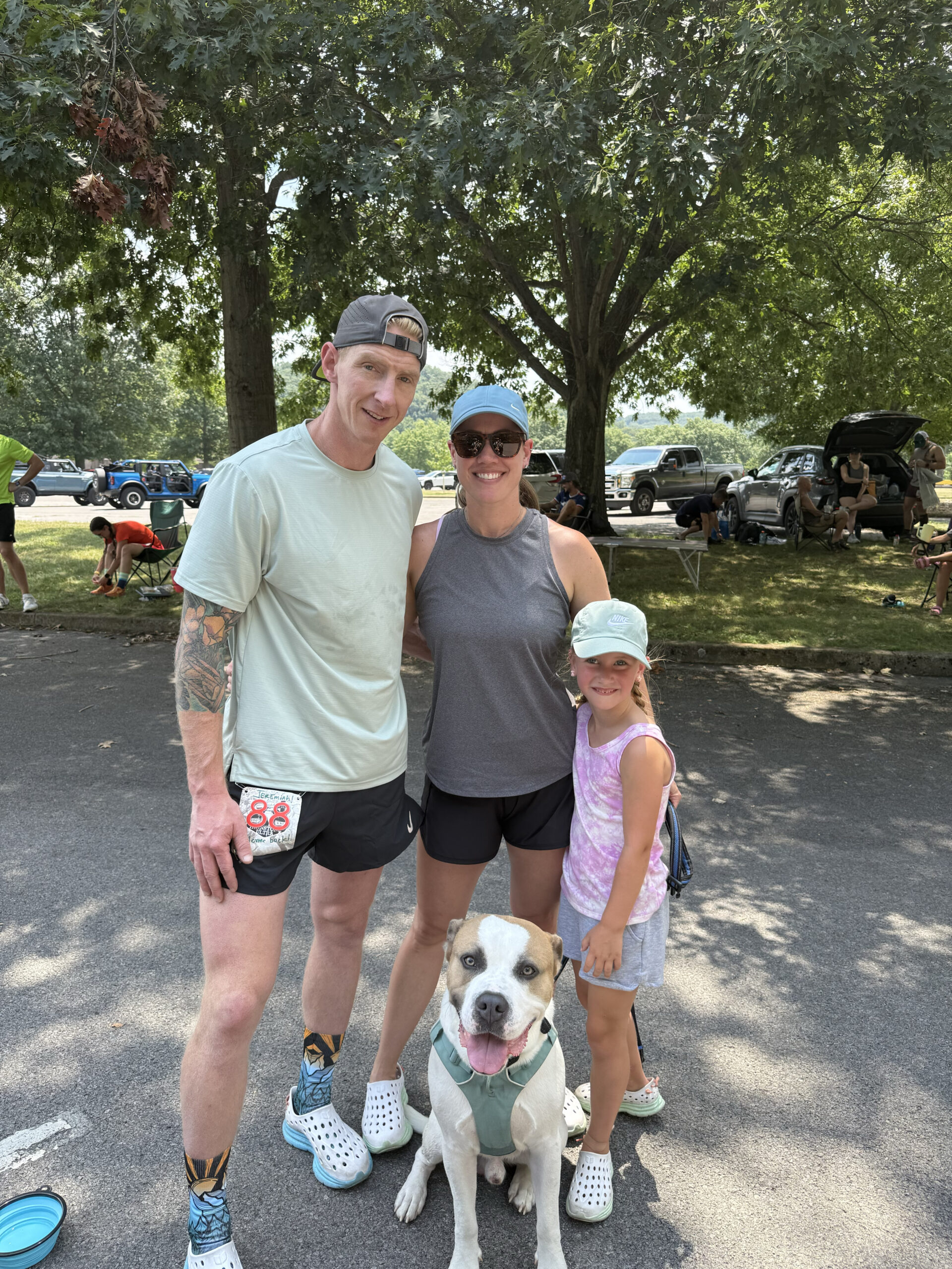 Jeremiah with his wife, daughter, and dog at a local race