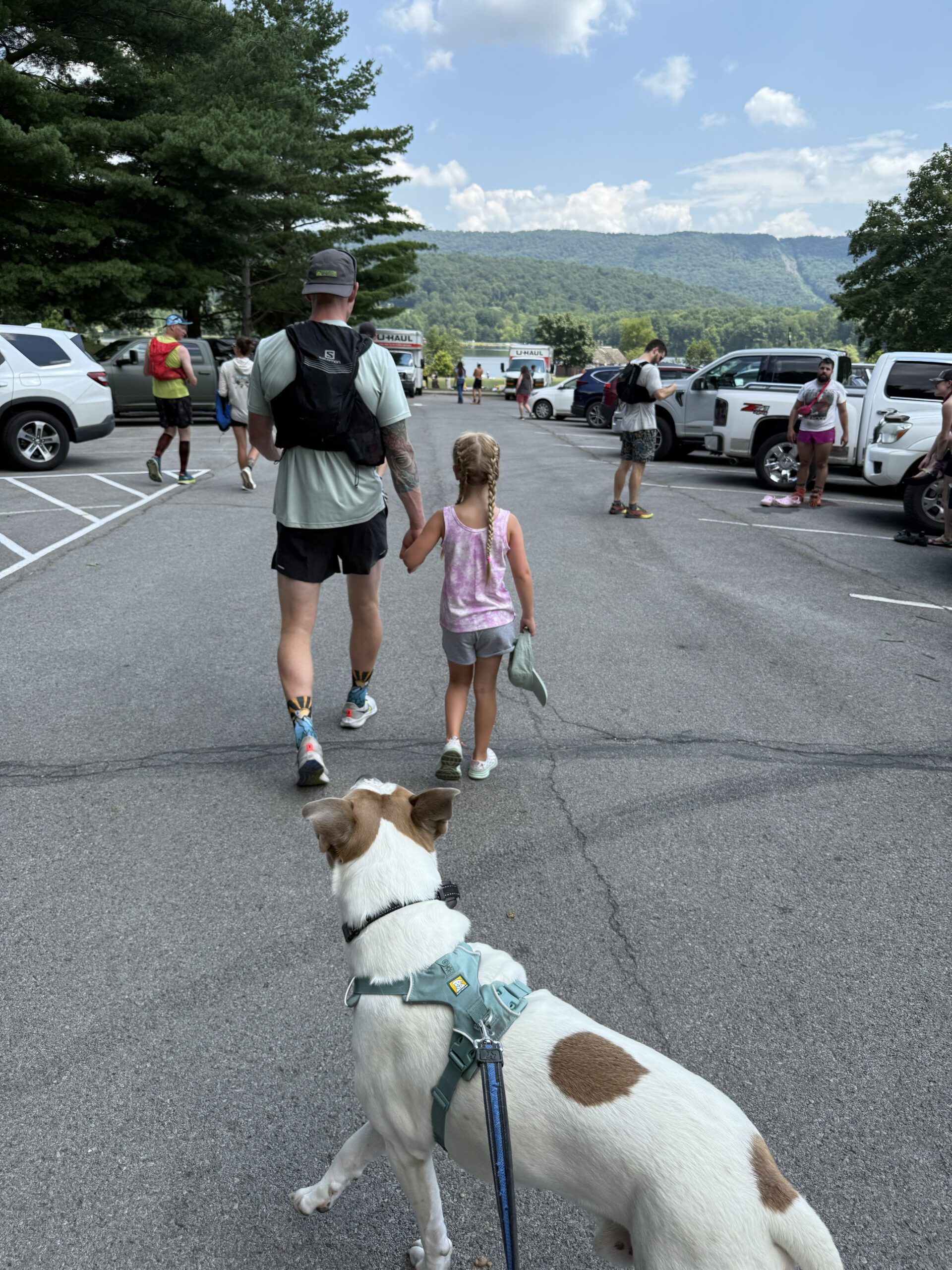 Jeremiah walking with his daughter and dog by the lake